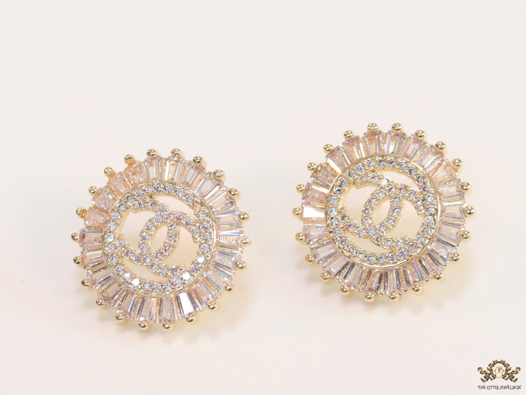 Round gold studs lined with cz baguettes and twin C cz motif centre