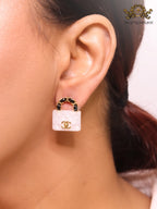Black and white Double C purse earrings in gold