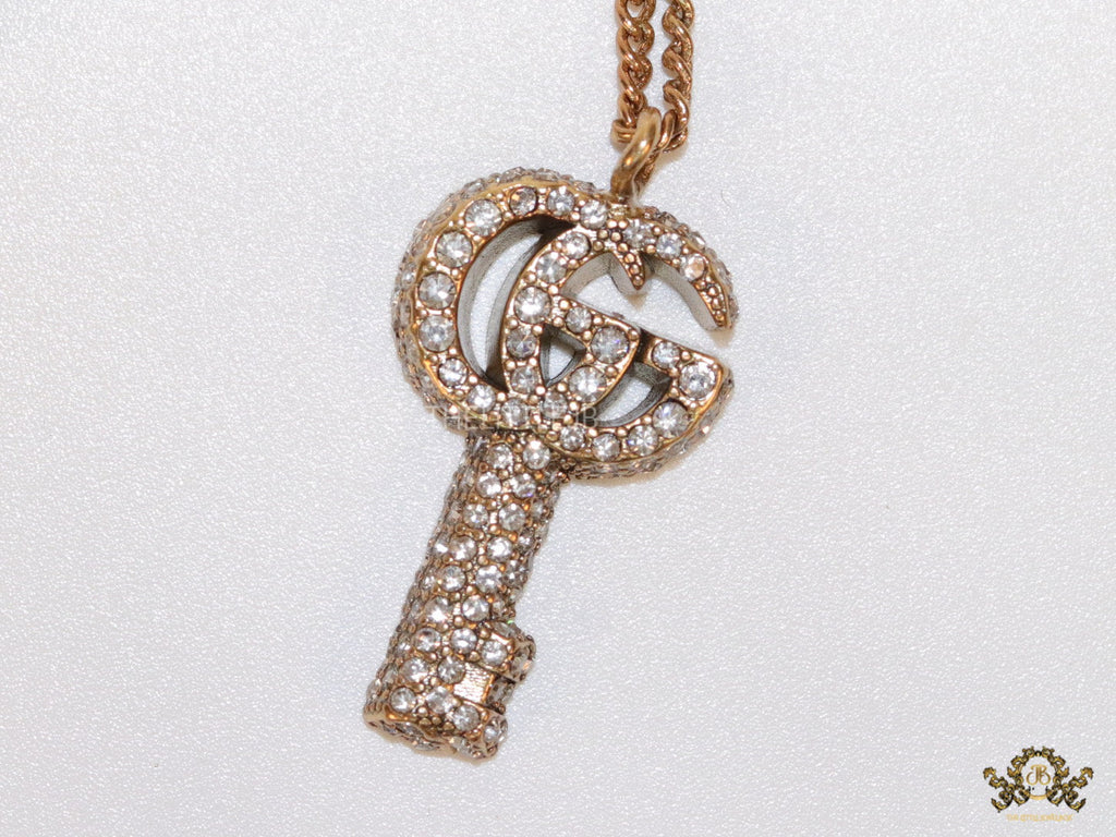 Gold plated chain necklace with cz G and key pendant