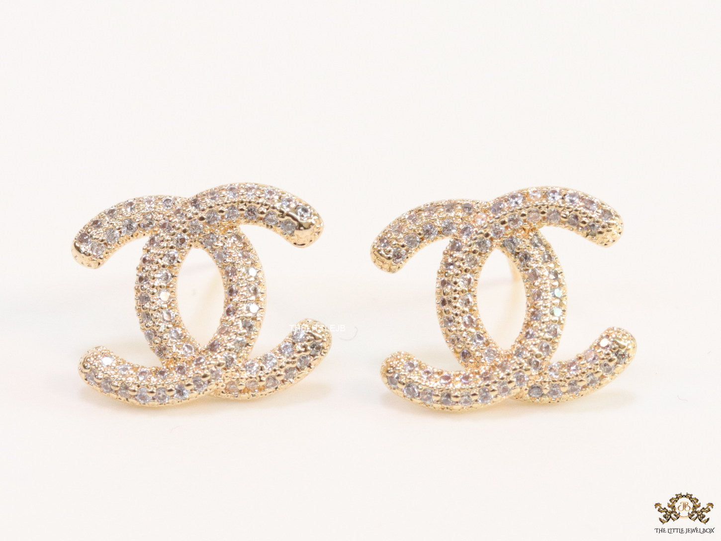 Gold plated twin C motif studs with cz