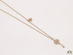 Golden chain necklace with pink clovers studded key pendant
