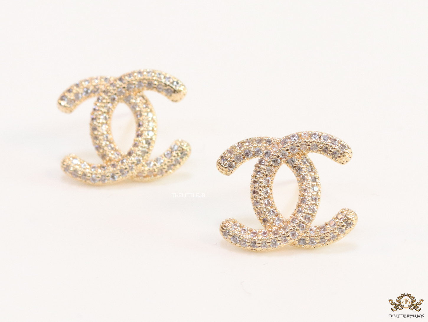 Gold plated twin C motif studs with cz