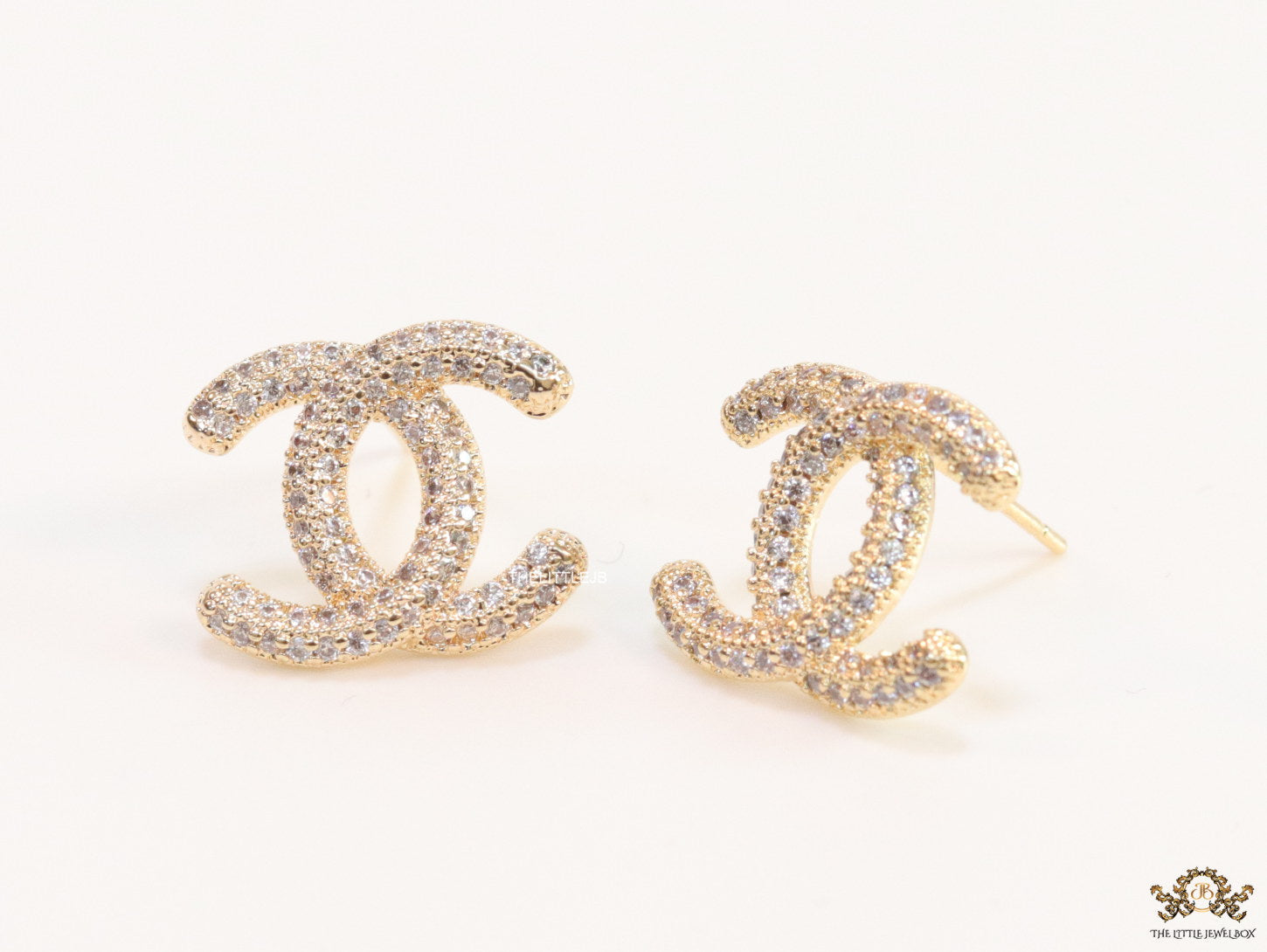 Gold plated twin C motif studs with cz