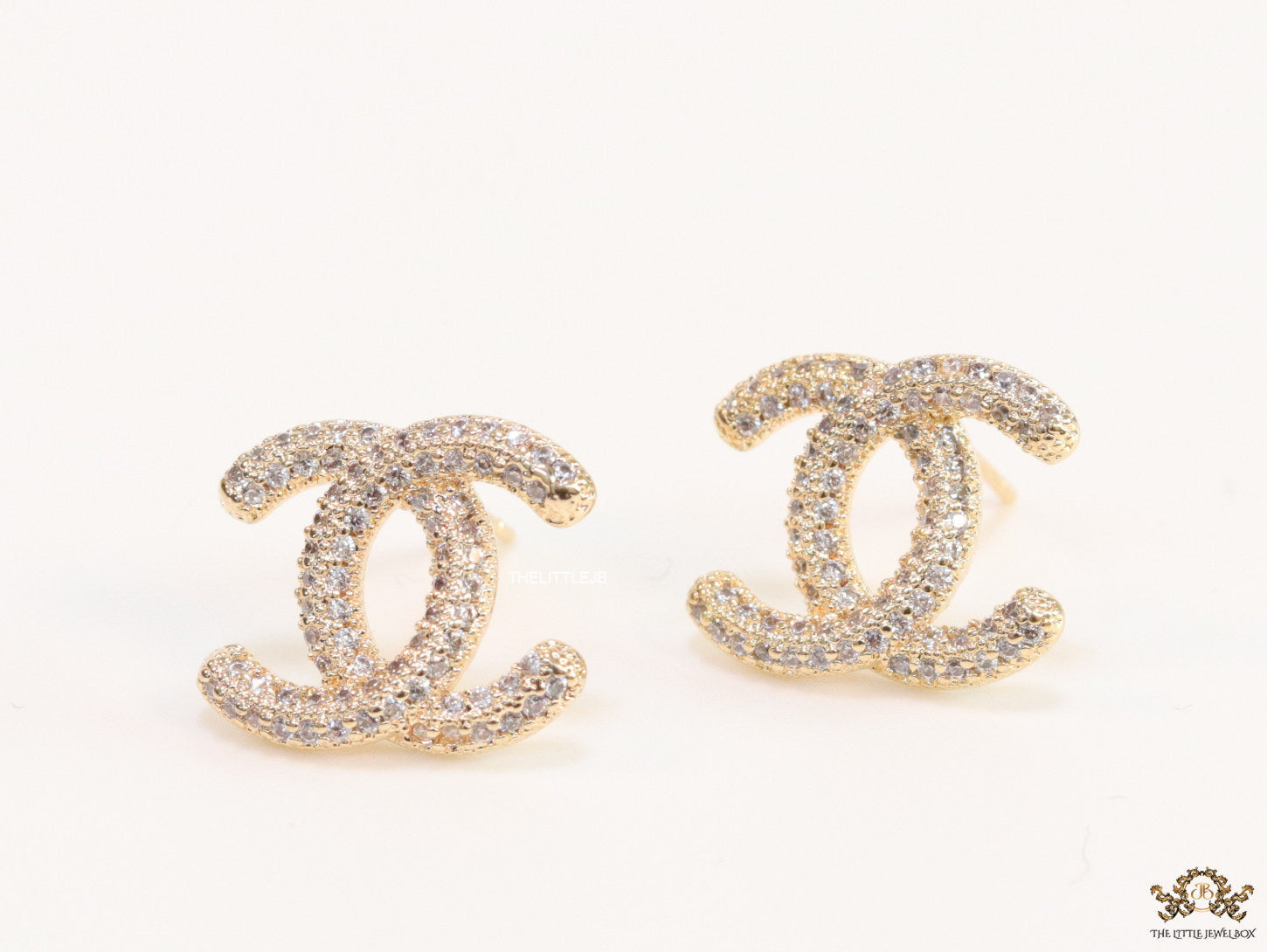 Gold plated twin C motif studs with cz