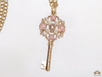 Golden chain necklace with pink clovers studded key pendant