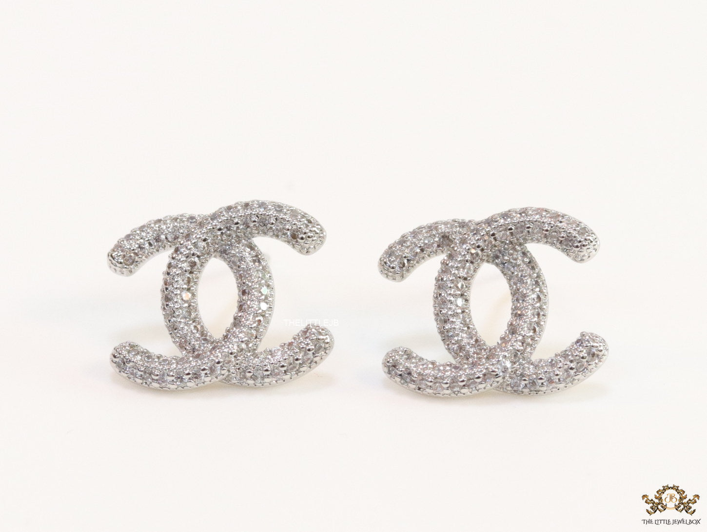 Platinum plated twin C motif studs with cz