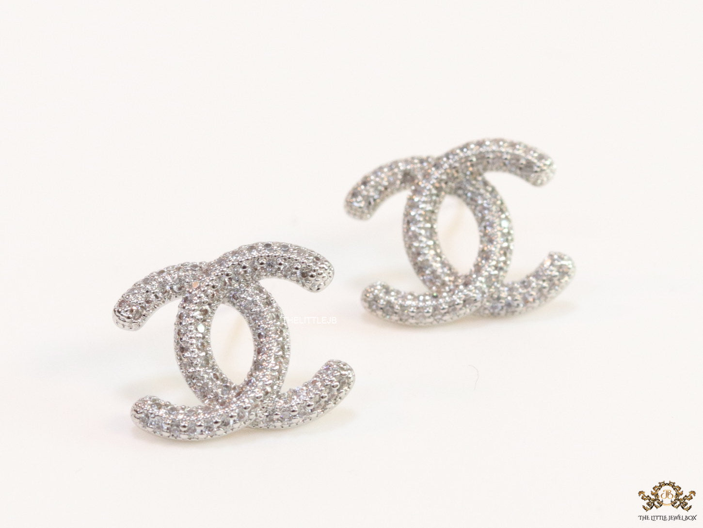 Platinum plated twin C motif studs with cz
