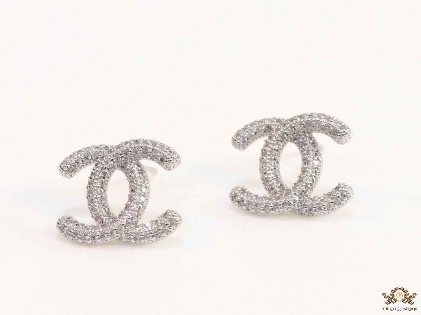 Platinum plated twin C motif studs with cz