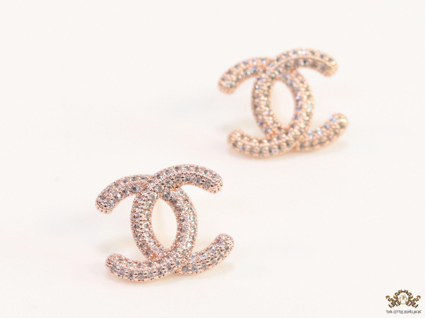 Rose gold plated twin C motif studs with cz