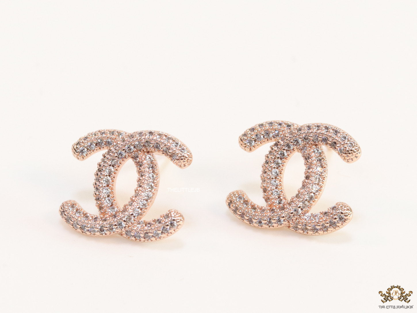 Rose gold plated twin C motif studs with cz