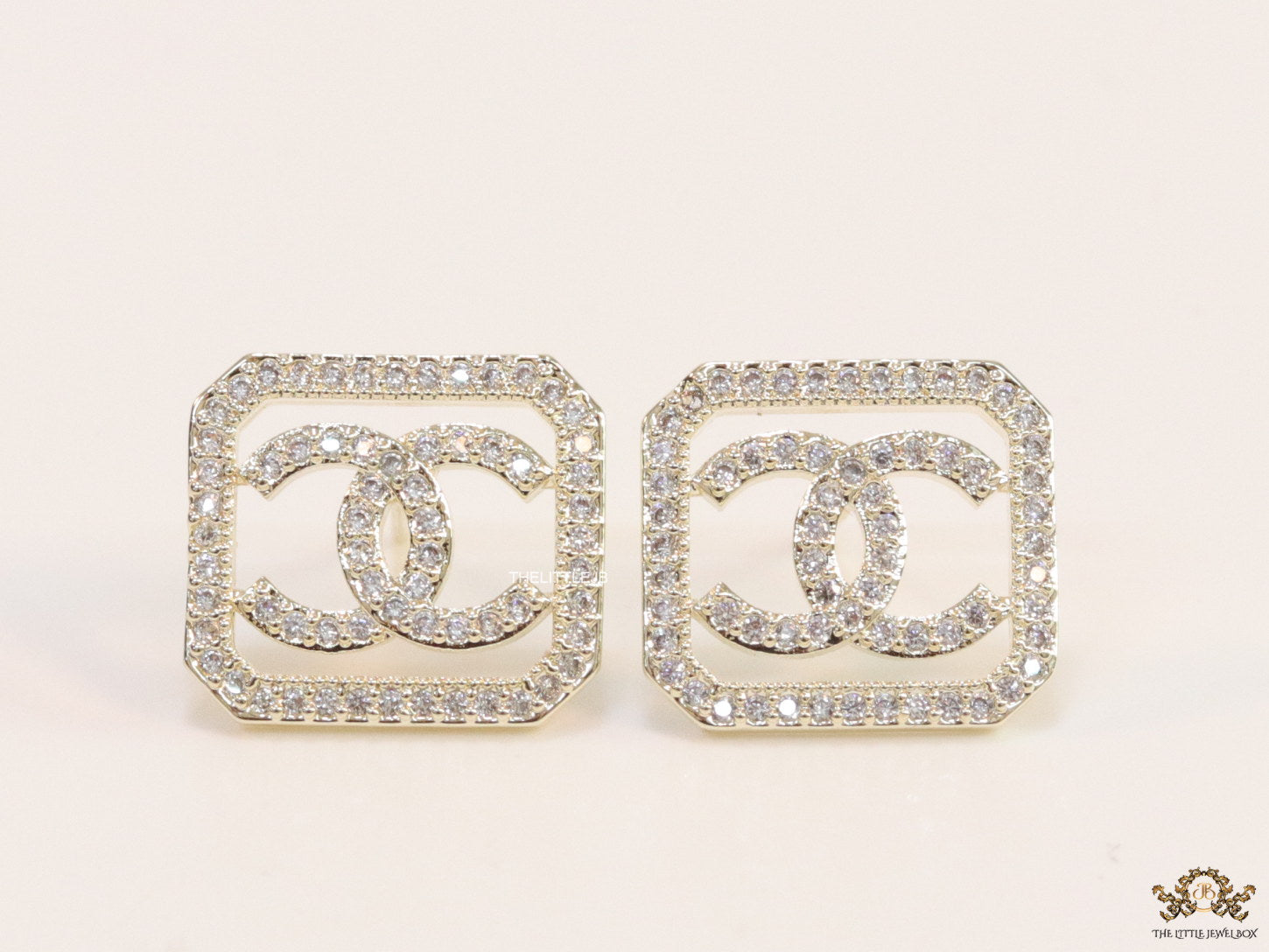 Gold plated square cz stud with twin C motif
