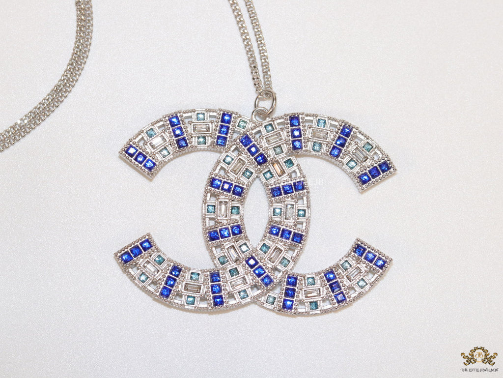 Platinum chain alphabet necklace with coloured cz
