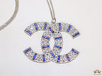 Platinum chain alphabet necklace with coloured cz