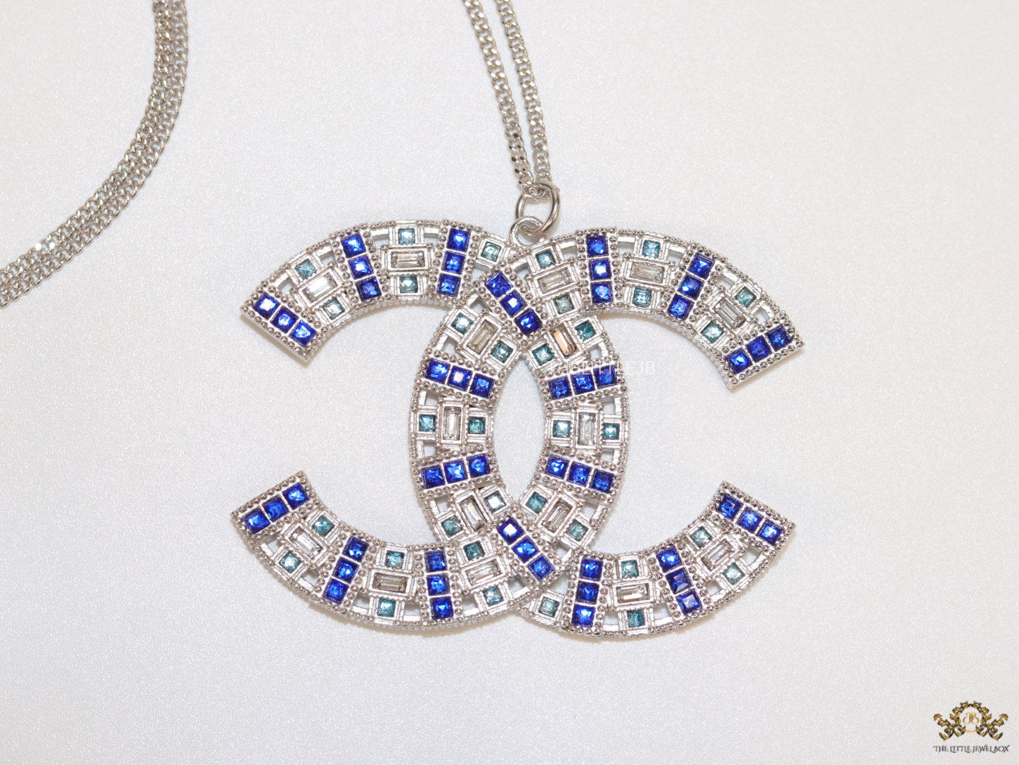 Platinum chain alphabet necklace with coloured cz
