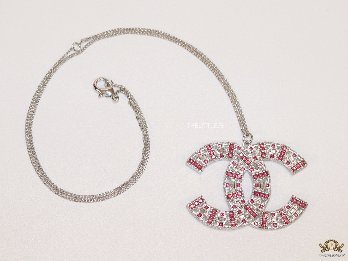 Platinum chain alphabet necklace with coloured cz