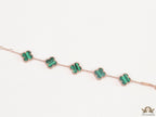 Rose gold plated chain bracelet with clovers in malachite green
