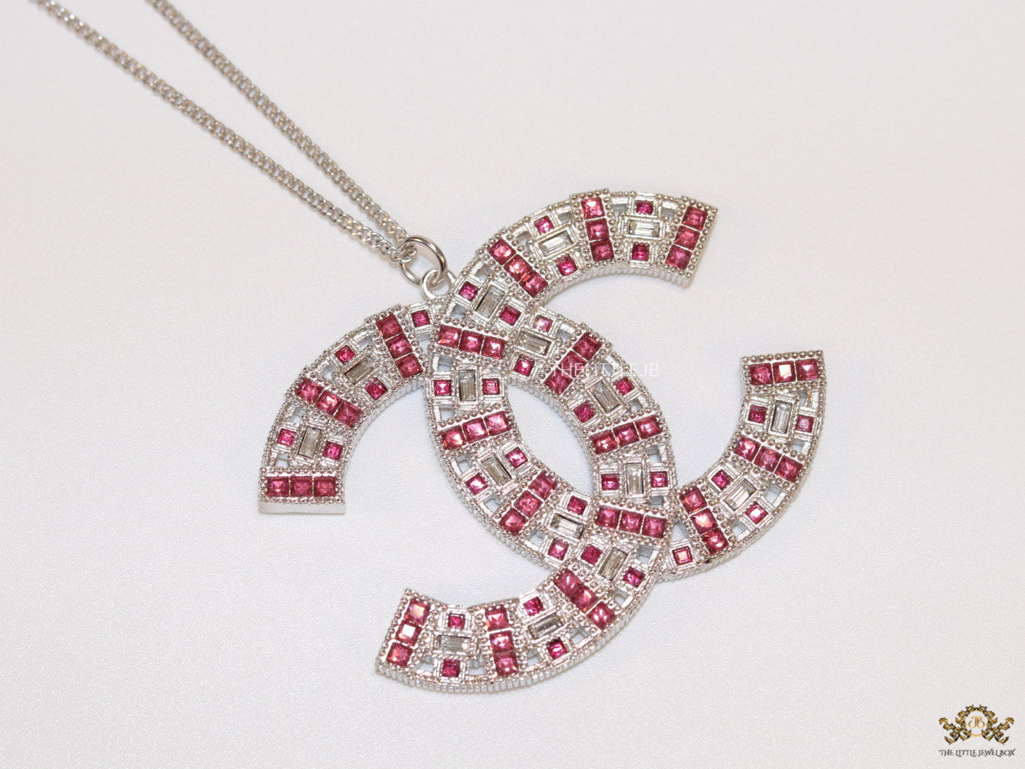 Platinum chain alphabet necklace with coloured cz