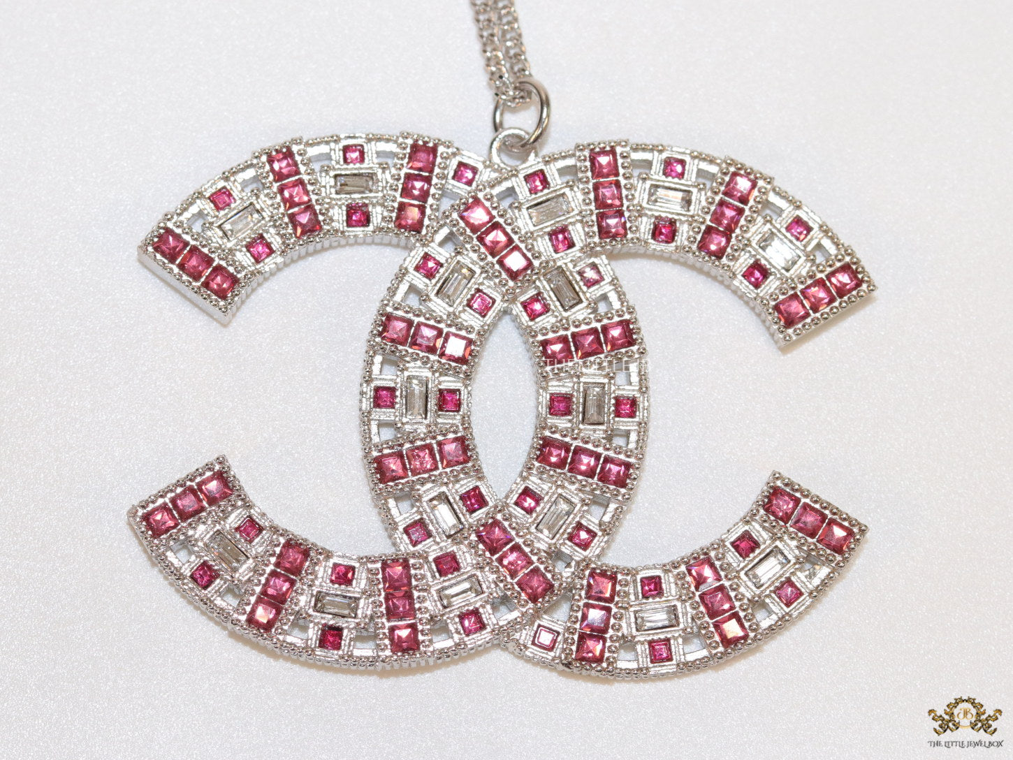Platinum chain alphabet necklace with coloured cz