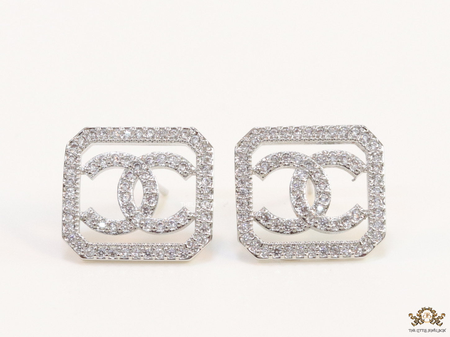 Platinum plated square cz stud with twin C motif