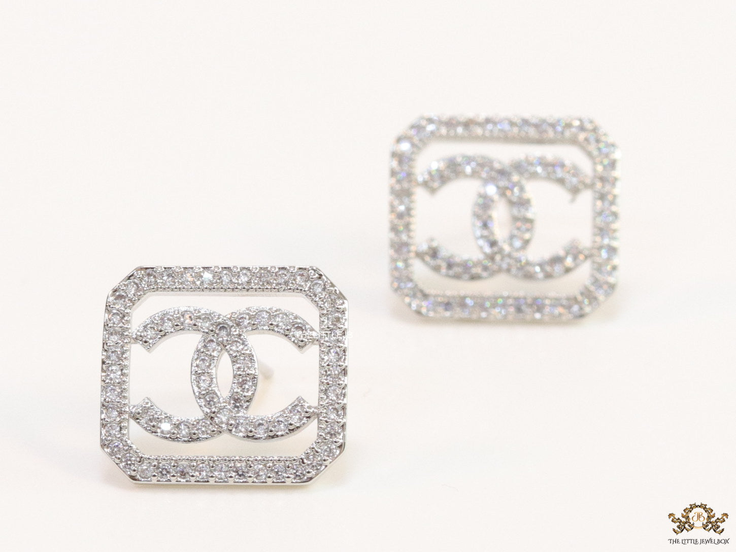 Platinum plated square cz stud with twin C motif