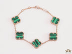Rose gold plated chain bracelet with clovers in malachite green