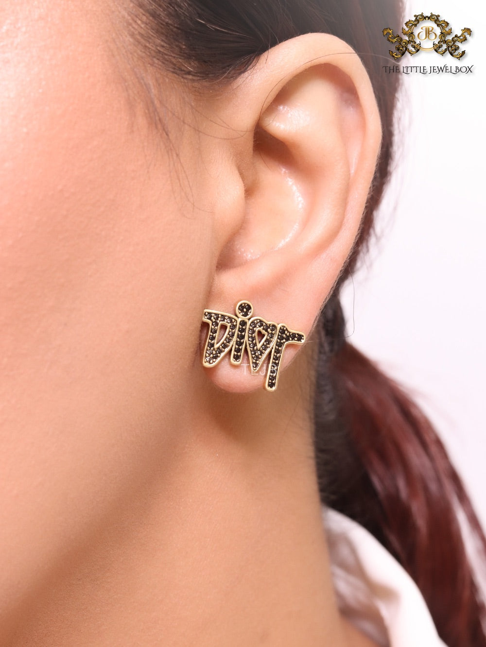 Gold Alphabet C and D earrings with black stones