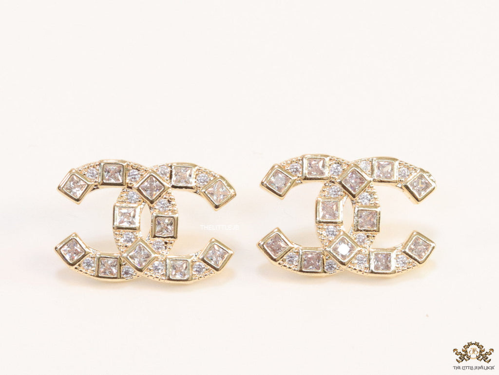 Golden twin C motif studs with fancy cut cz