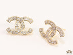 Golden twin C motif studs with fancy cut cz