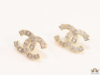 Golden twin C motif studs with fancy cut cz