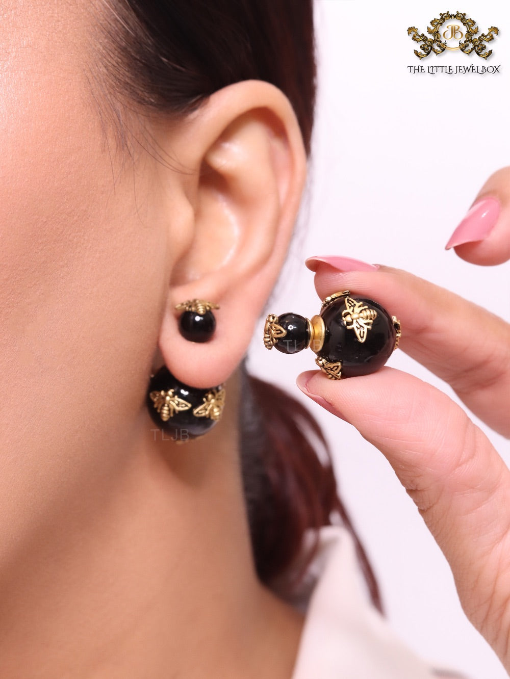 Rustic dragonfly on black pearls in gold