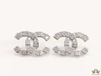Platinum plated twin C motif studs with fancy cut cz