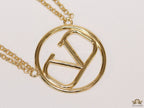 Dual chain golden necklace with alphabet pendant