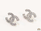 Platinum plated twin C motif studs with fancy cut cz
