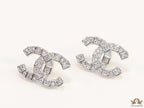 Platinum plated twin C motif studs with fancy cut cz