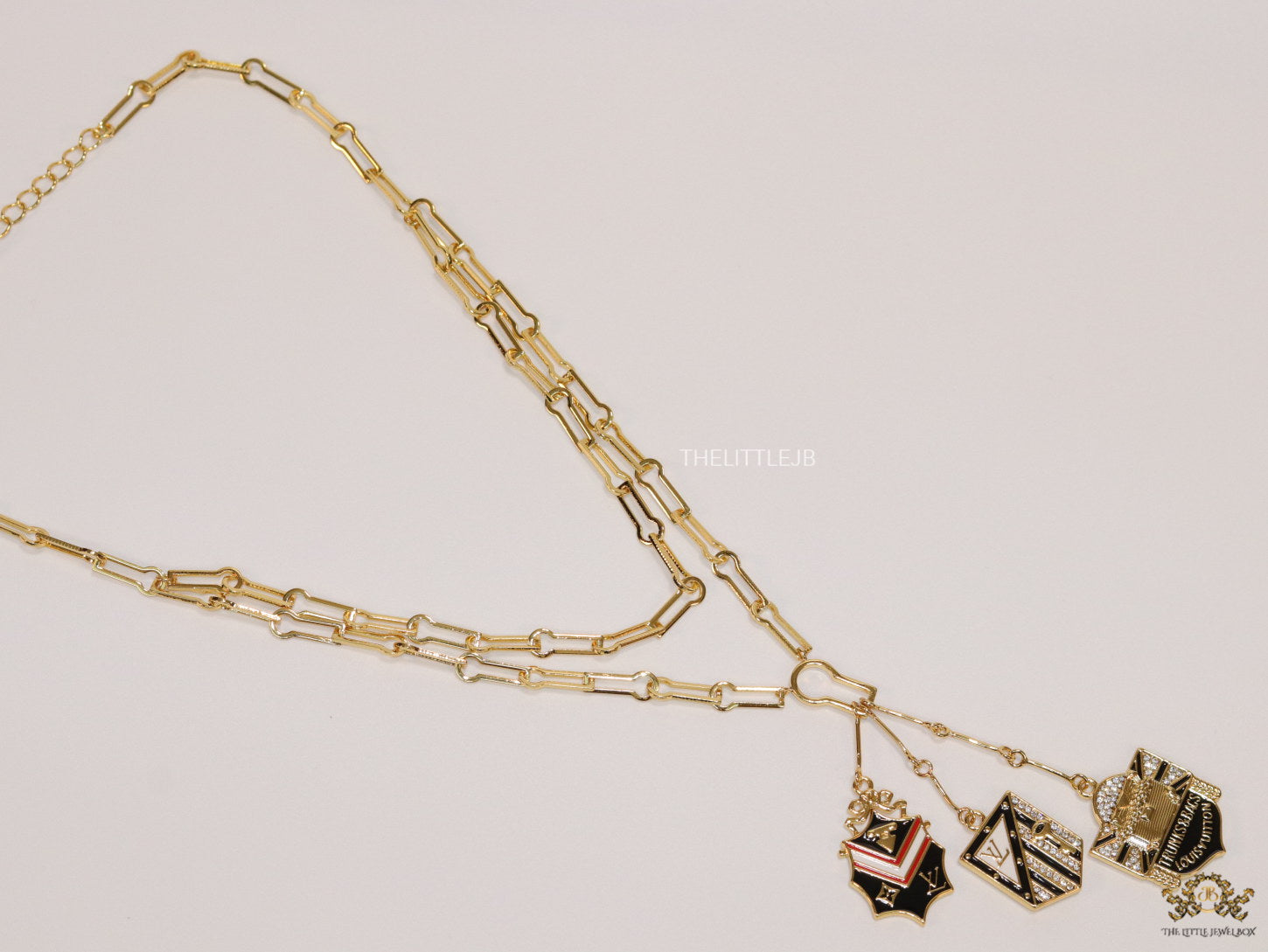 Dual link chain necklace with three in one pendant