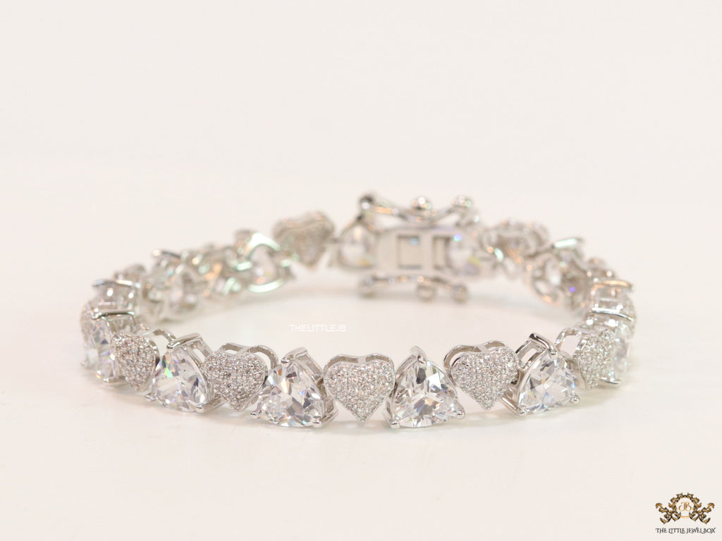 Fancy cut triangle and heart shape cz bracelet in platinum finish