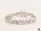 Fancy cut triangle and heart shape cz bracelet in platinum finish