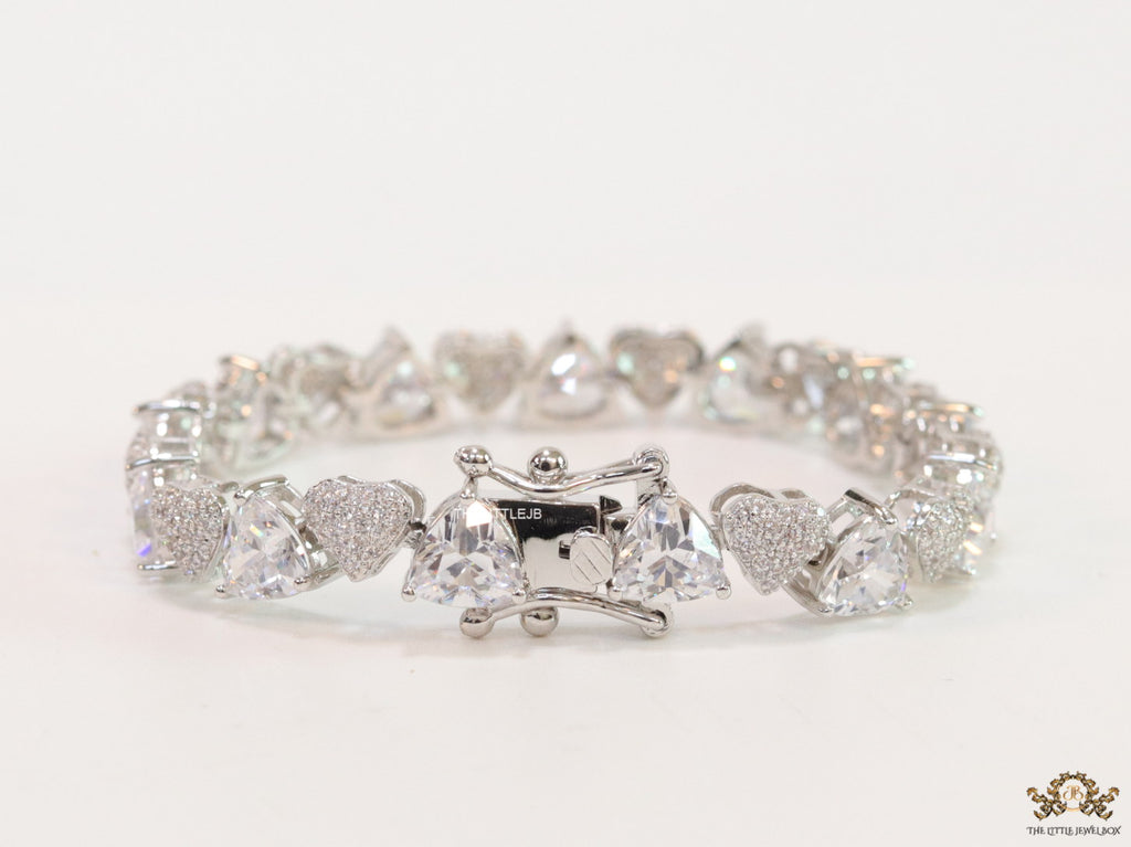 Fancy cut triangle and heart shape cz bracelet in platinum finish