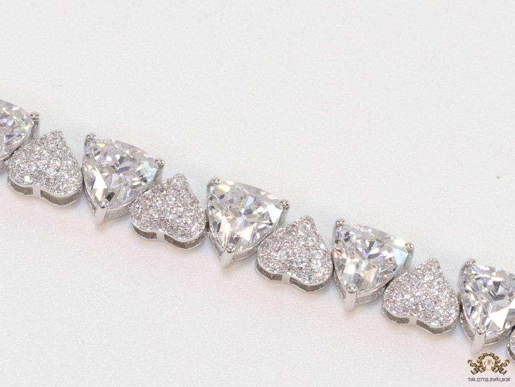 Fancy cut triangle and heart shape cz bracelet in platinum finish