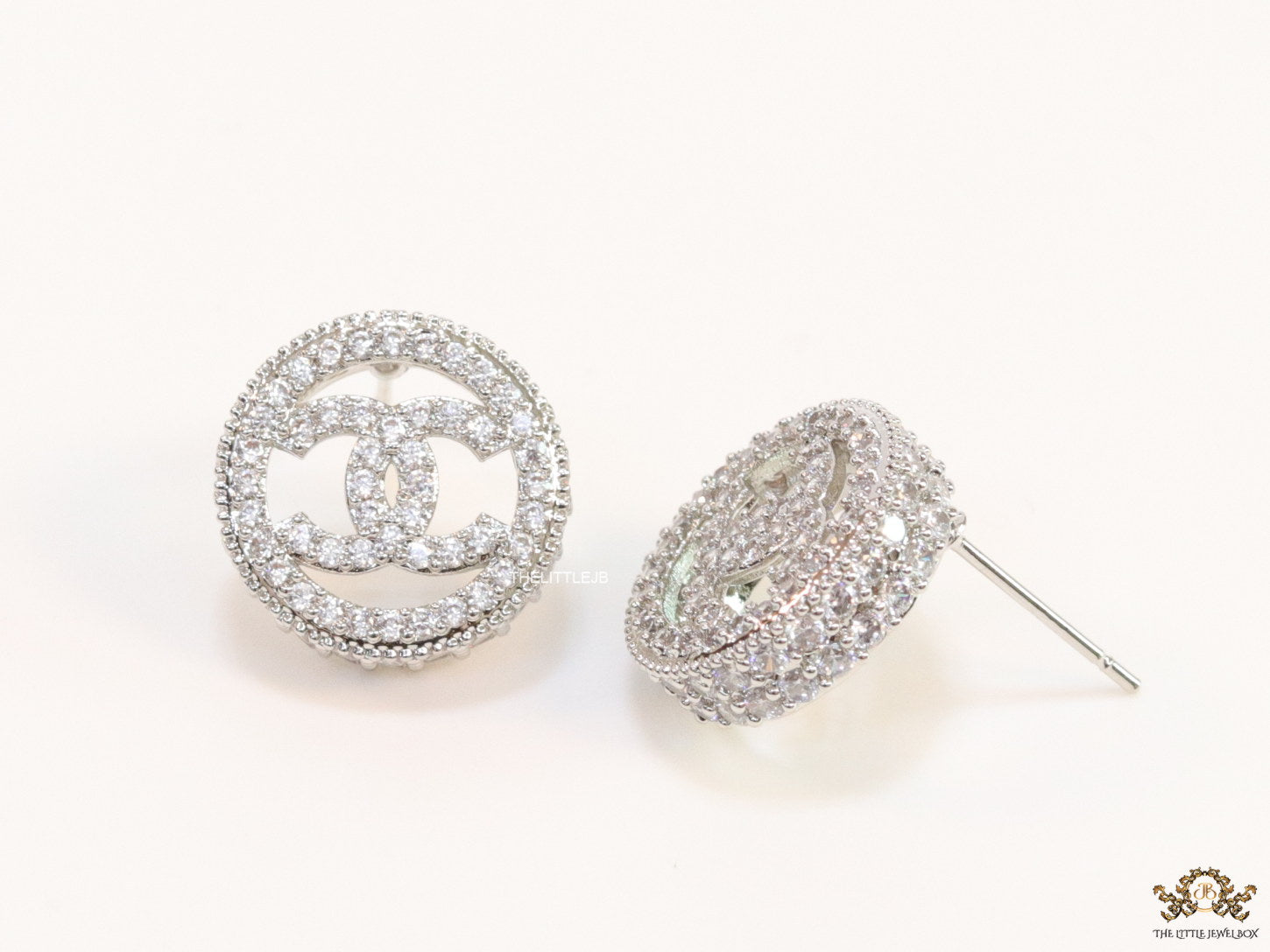 Round platinum studs lined with cz and twin C motif centre