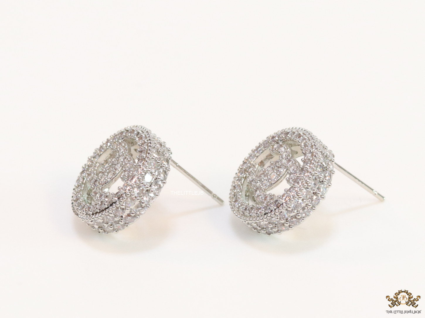 Round platinum studs lined with cz and twin C motif centre