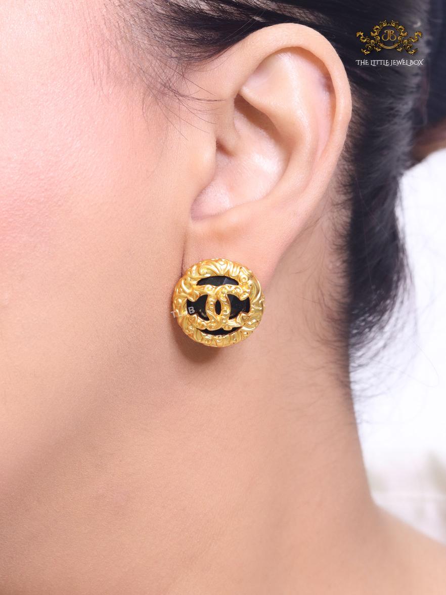 Black and gold double C studs
