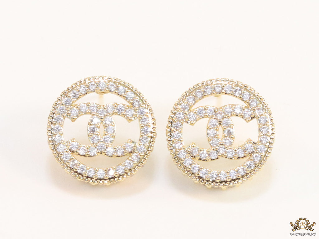 Round golden studs lined with cz and twin C motif centre