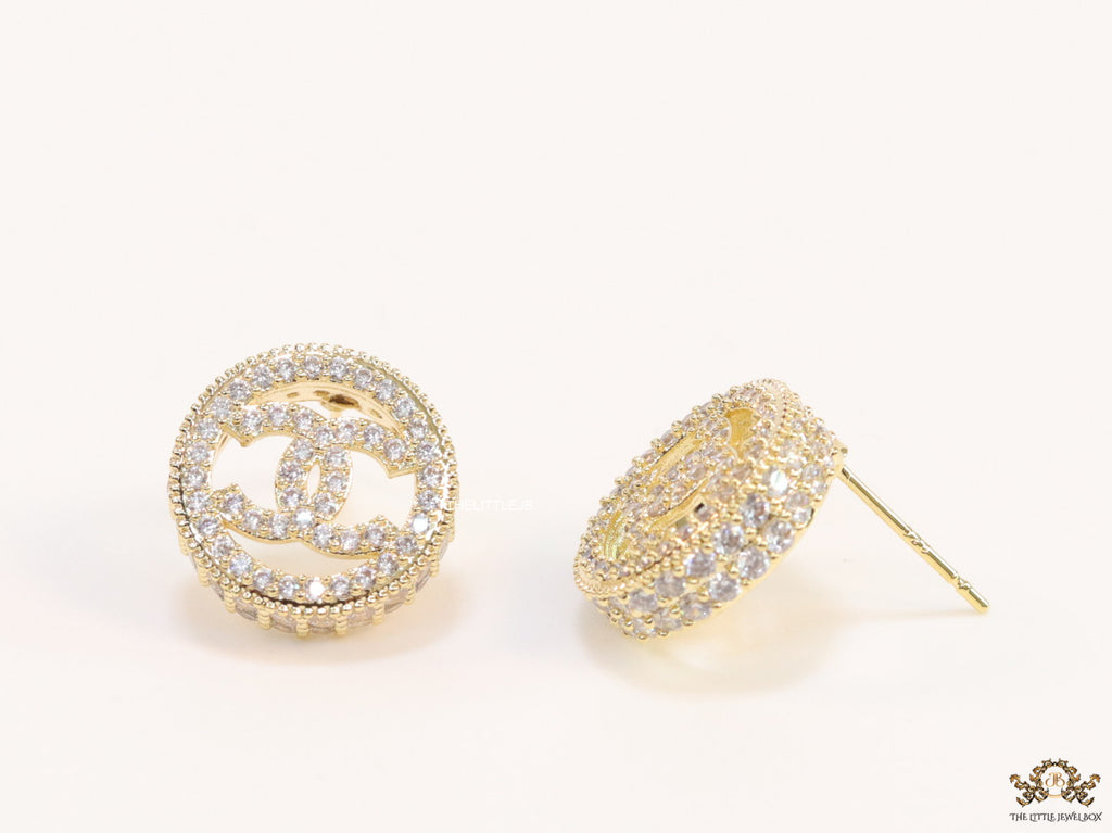 Round golden studs lined with cz and twin C motif centre