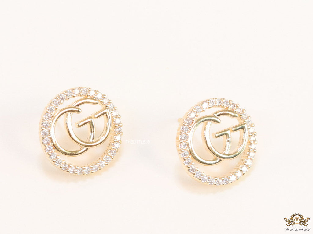 Gold plated round cz earrings with twin G motif