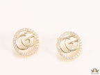 Gold plated round cz earrings with twin G motif