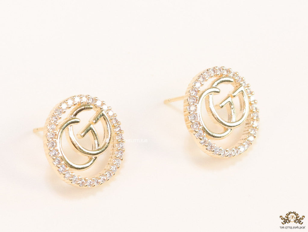 Gold plated round cz earrings with twin G motif