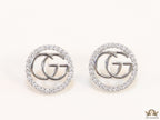 Platinum plated round cz earrings with twin G motif