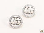 Platinum plated round cz earrings with twin G motif