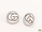 Platinum plated round cz earrings with twin G motif